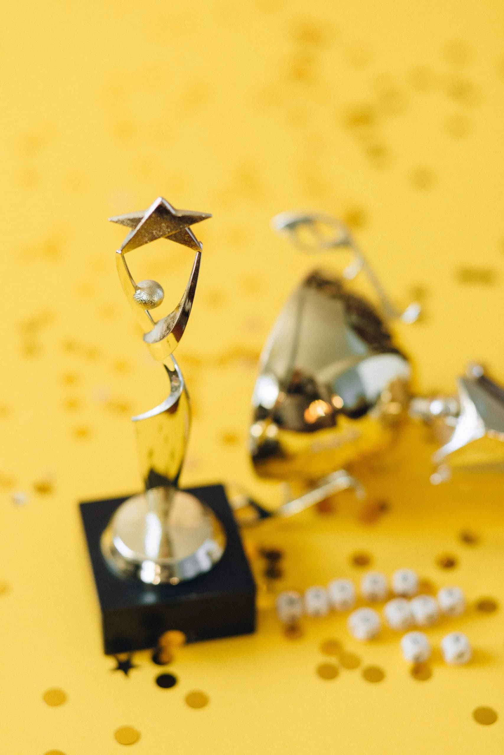 A gold trophy surrounded by celebration confetti