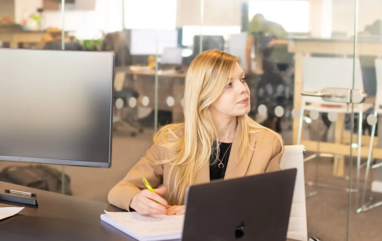 A Propeller Pay adviser working at her desk